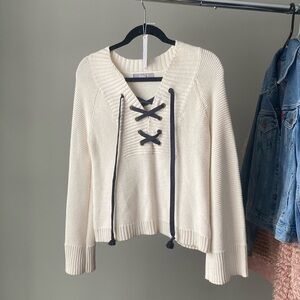 Cream sweater with ties and bell sleeves